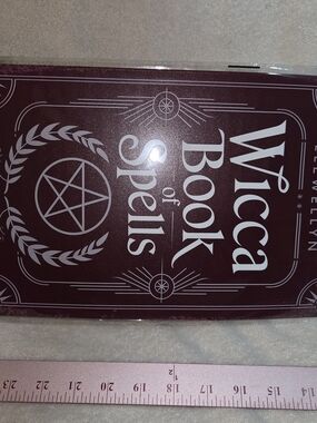 Wicca Book of Spells Metal Sign - Deep Plum Cover